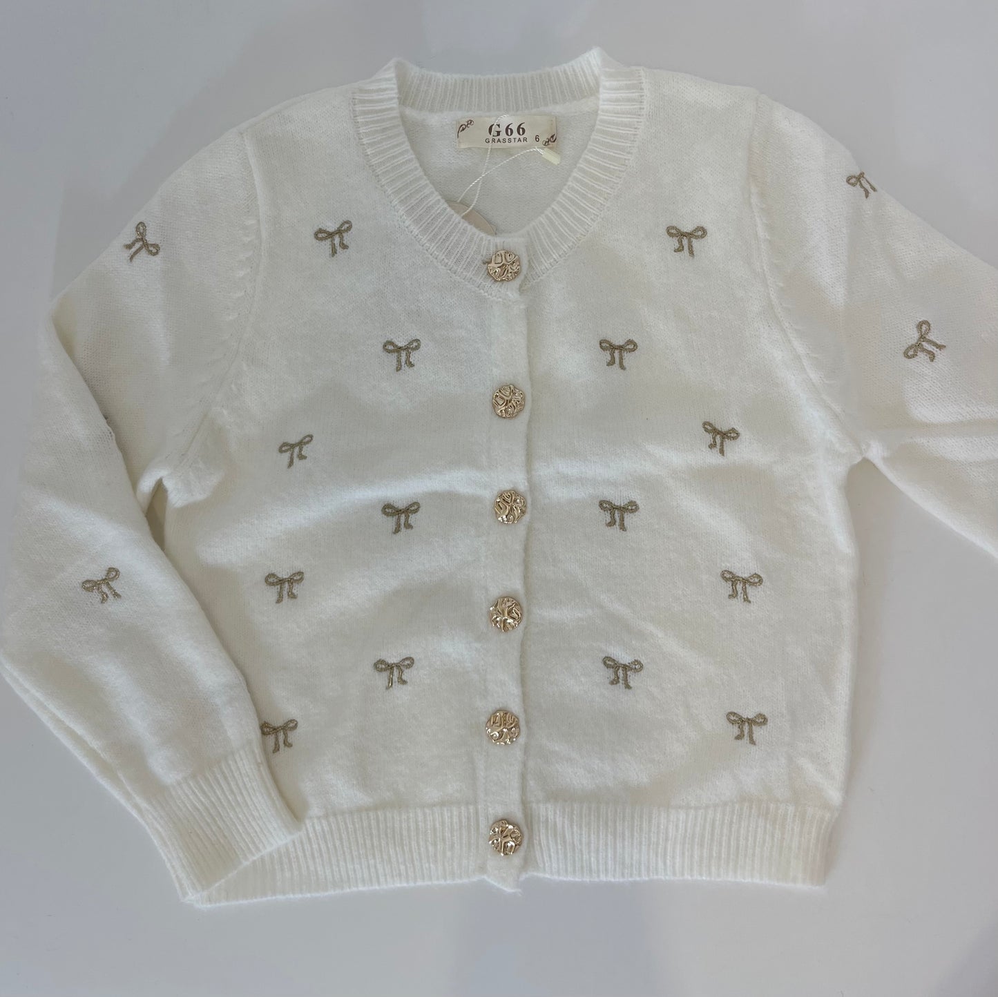 Gilet blanc avec petits noeuds brodés